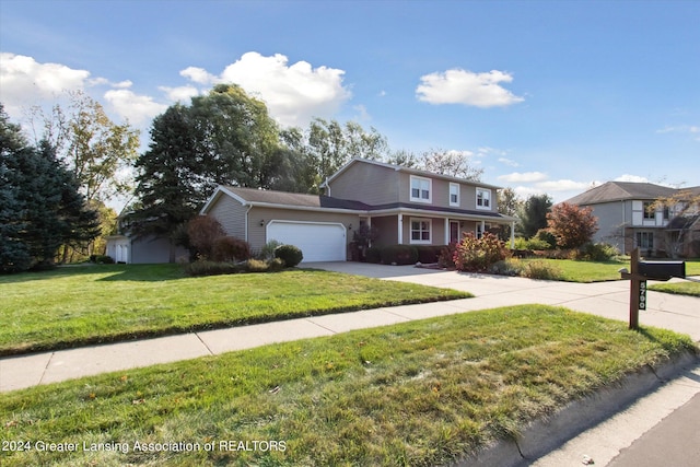 front facade featuring a front yard and a garage