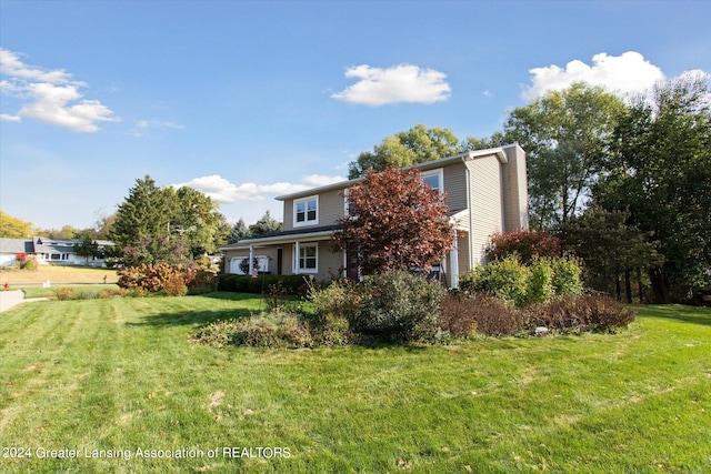 view of front of home with a front lawn