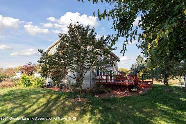 view of yard with a wooden deck