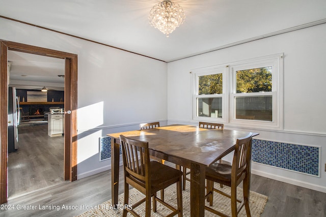 dining room featuring a chandelier and hardwood / wood-style flooring