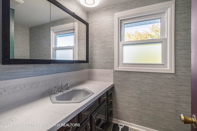 bathroom featuring plenty of natural light and vanity