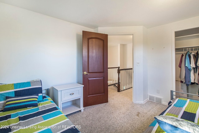 carpeted bedroom featuring a closet