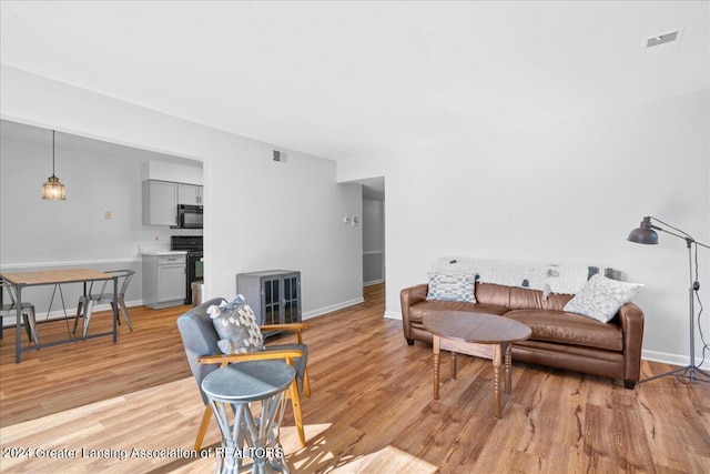 living room with light hardwood / wood-style floors