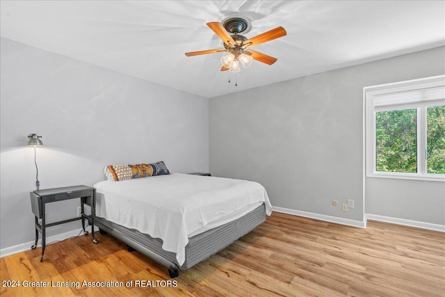 bedroom featuring light hardwood / wood-style flooring and ceiling fan