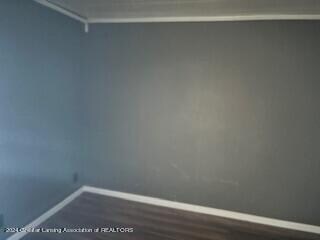 walk in closet featuring dark wood-type flooring