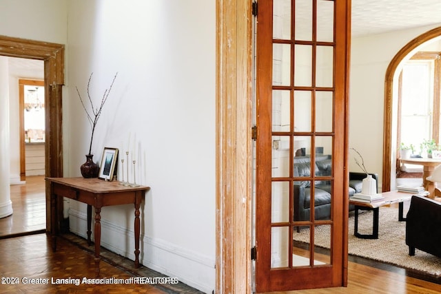 hall with hardwood / wood-style floors