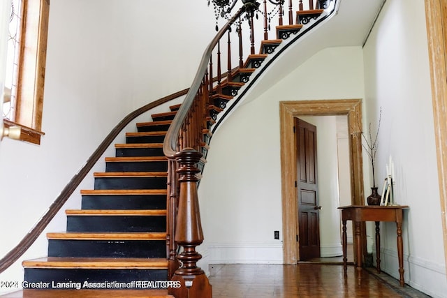 stairs featuring wood-type flooring