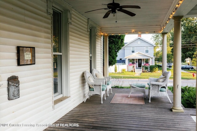 deck featuring covered porch and ceiling fan