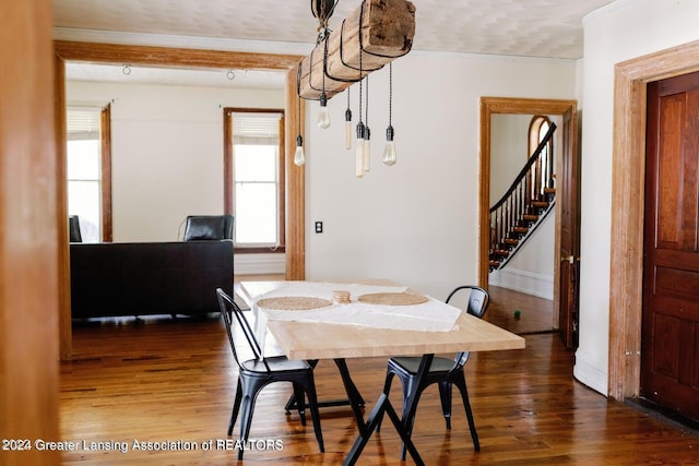 dining area with dark hardwood / wood-style flooring