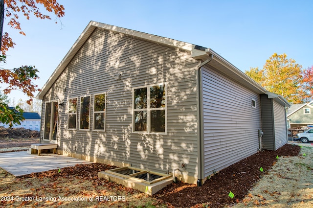 1534 Lytell Johnes Path # 76, Williamston, MI 48895 - view of side of home with a patio area