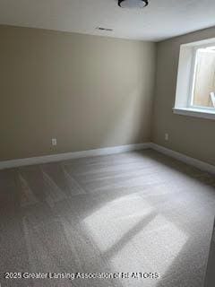 empty room with baseboards