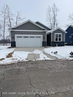 view of front of property with driveway and a garage