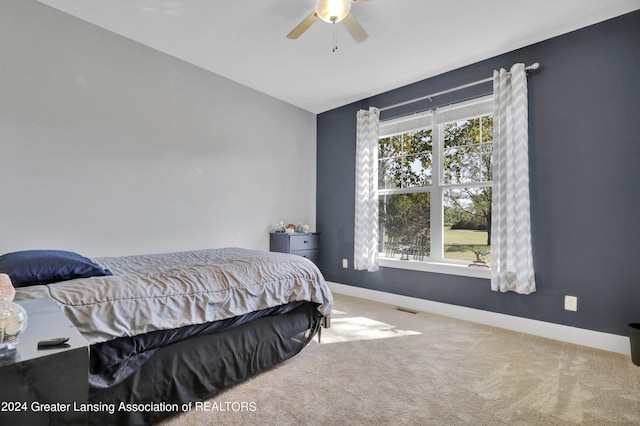 carpeted bedroom with ceiling fan