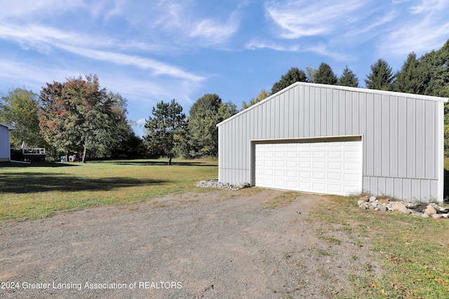 garage with a lawn