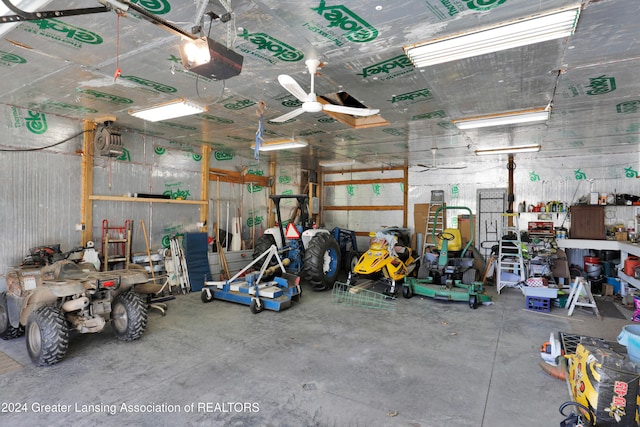 garage with ceiling fan and a garage door opener