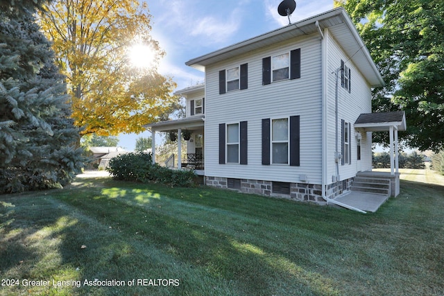 view of home's exterior with a lawn