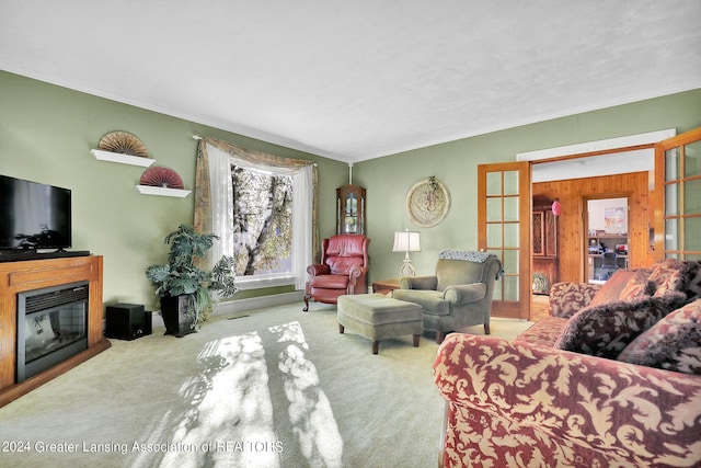 living room featuring ornamental molding, wooden walls, and light colored carpet