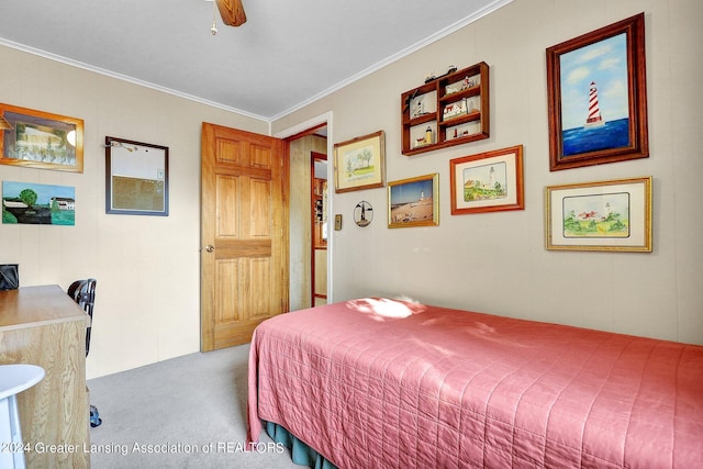 bedroom with carpet floors, crown molding, and ceiling fan