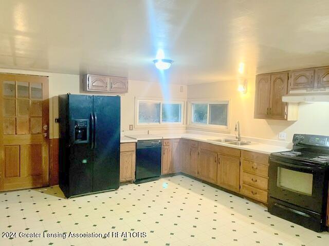 kitchen with black appliances and sink