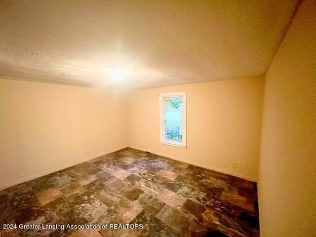 bonus room with vaulted ceiling