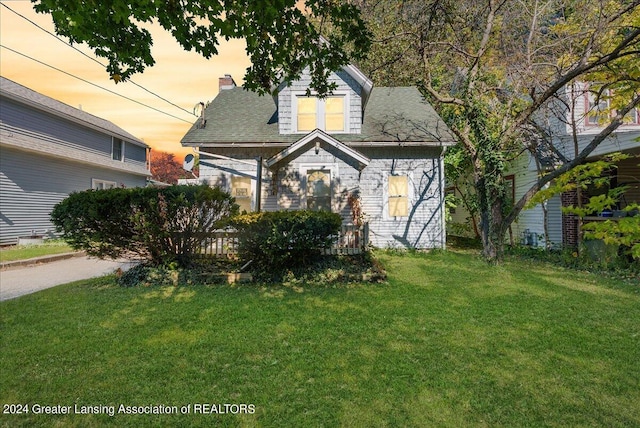 view of front of home with a lawn