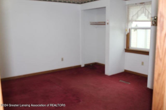 unfurnished bedroom with carpet flooring