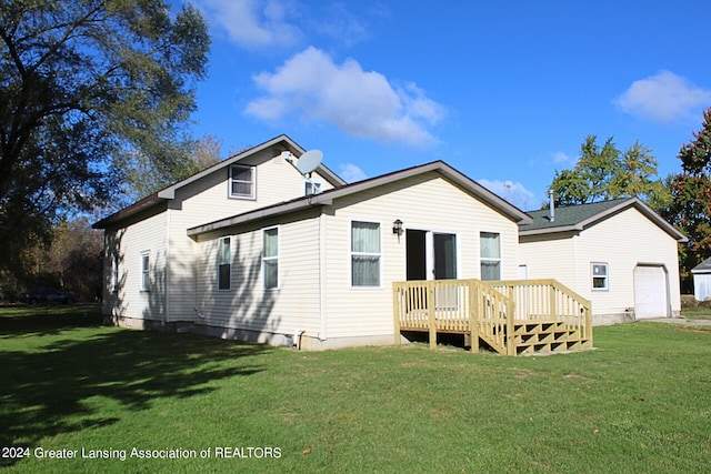 back of property featuring a deck and a yard