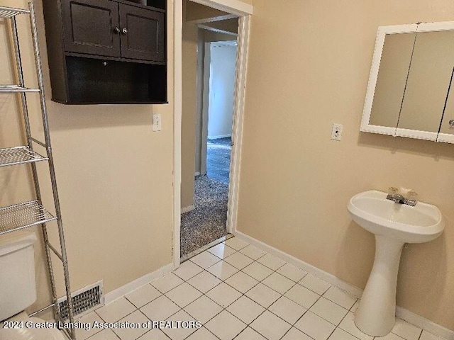 bathroom with tile patterned floors and sink