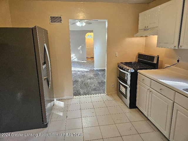 kitchen with stainless steel appliances, ceiling fan, range hood, and white cabinetry