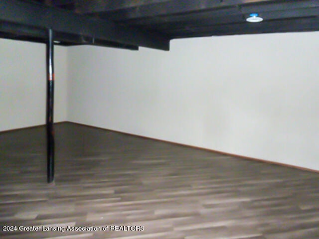 basement featuring wood-type flooring