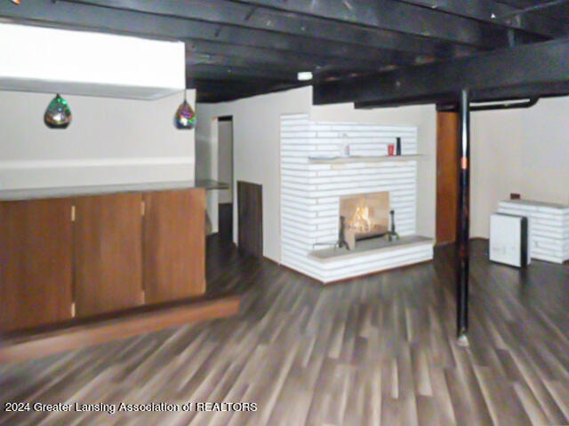 basement featuring dark wood-type flooring