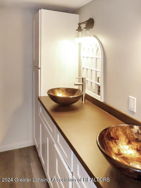 bathroom featuring vanity and hardwood / wood-style flooring