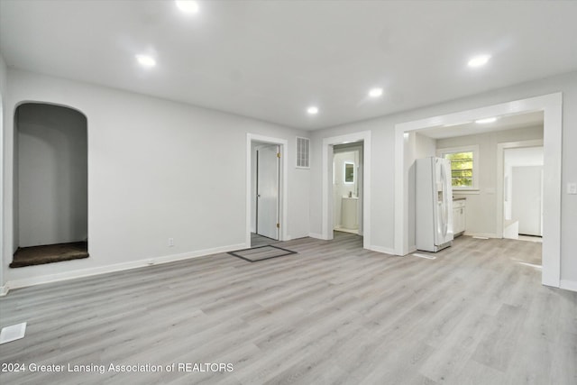 unfurnished living room featuring light hardwood / wood-style flooring