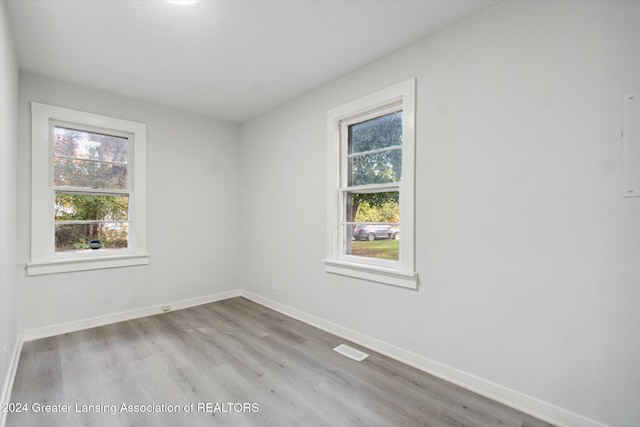 unfurnished room with light hardwood / wood-style flooring