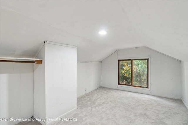 bonus room featuring light carpet and lofted ceiling