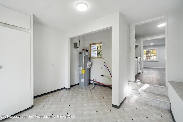 utility room with water heater