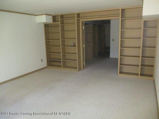 interior space featuring light colored carpet