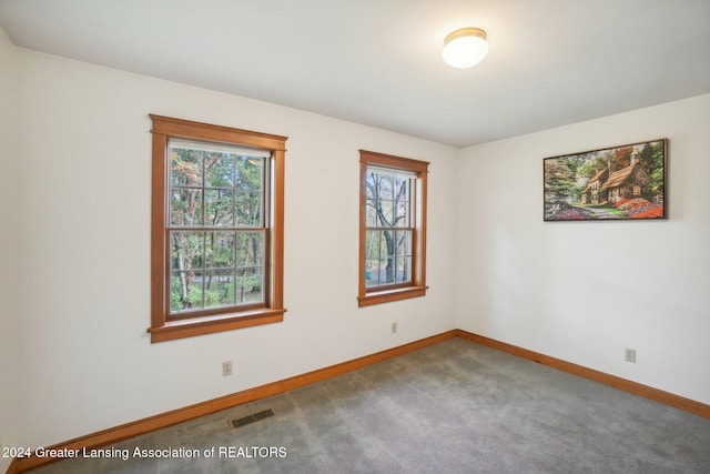 empty room featuring carpet flooring