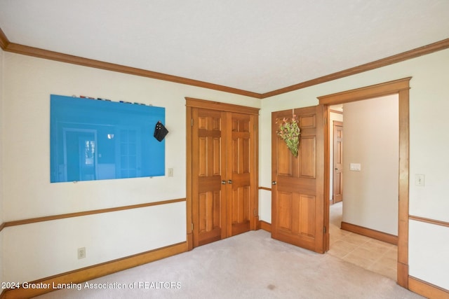 unfurnished bedroom with light carpet and ornamental molding