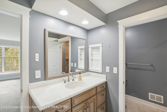 bathroom featuring tile patterned floors and vanity