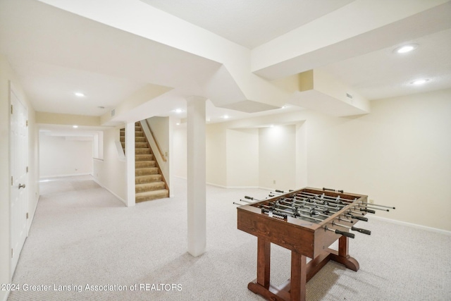 recreation room featuring light carpet