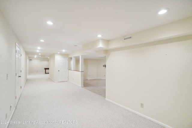 basement with light colored carpet