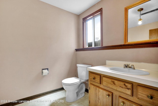 bathroom with vanity and toilet