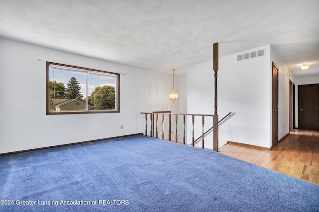 spare room featuring hardwood / wood-style floors