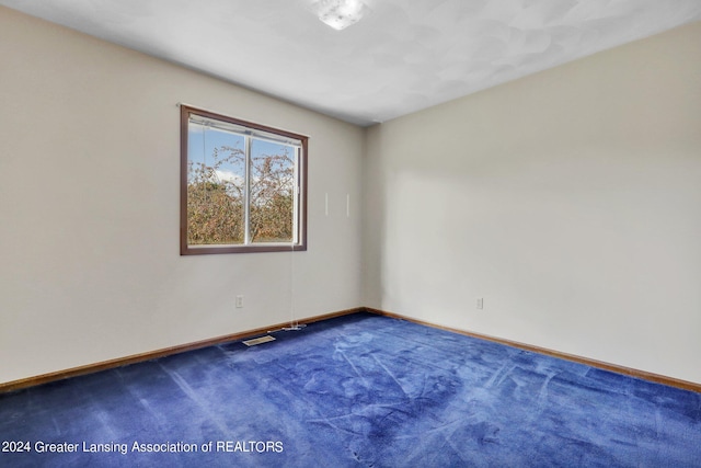 empty room with carpet flooring