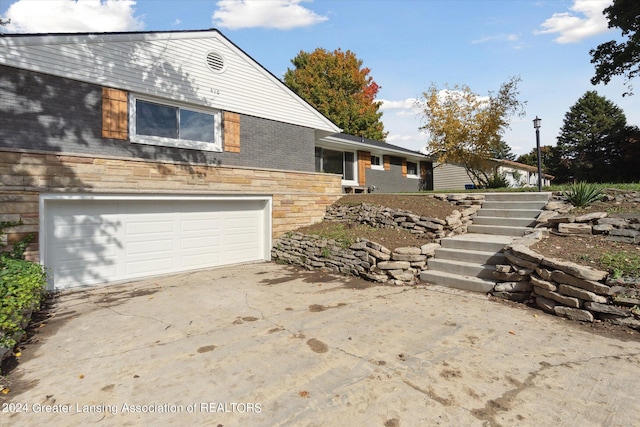 view of side of property with a garage