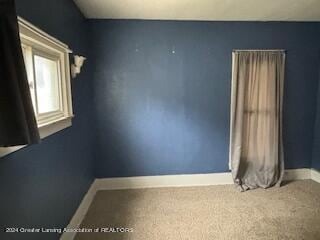 spare room with carpet