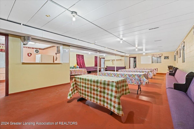 game room with concrete flooring