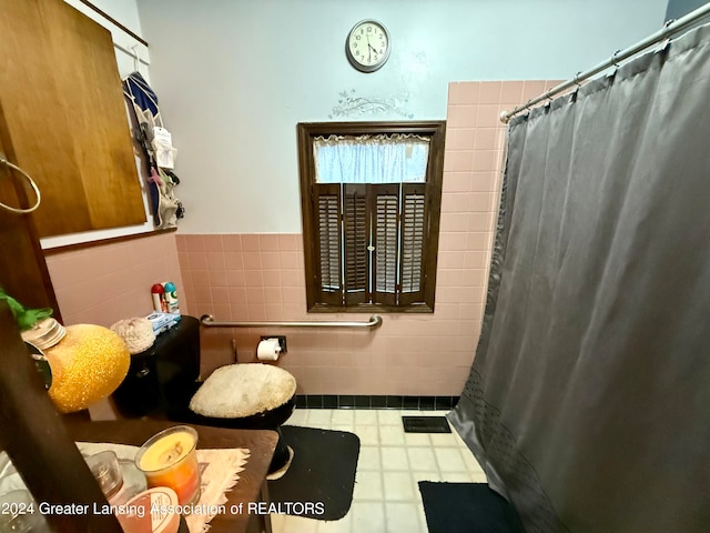 bathroom featuring tile walls and walk in shower