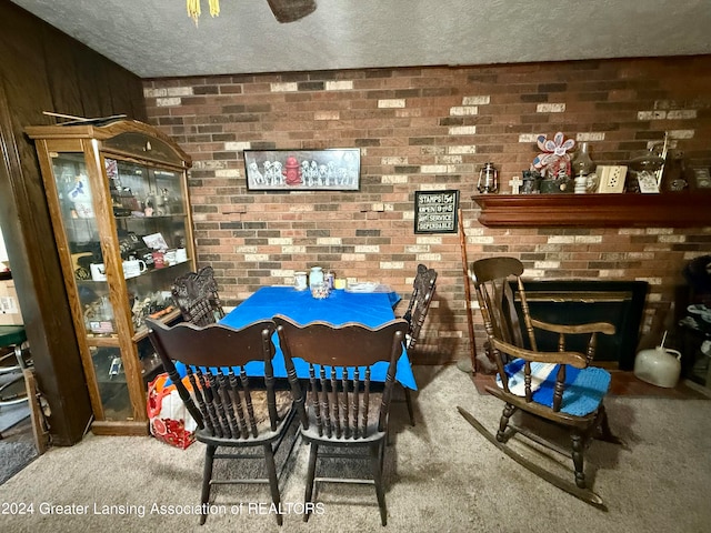 carpeted dining area with wooden walls and a textured ceiling